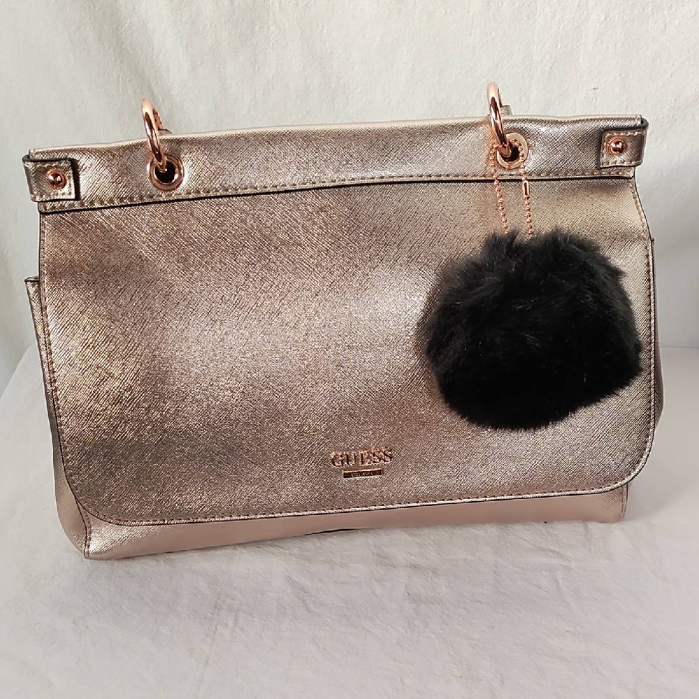 Guess' Gold Shoulder Bag with Black Pom Pom Accent